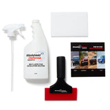 Car windshield cleaning kit with spray bottles, squeegee, and instructional guide on a white background